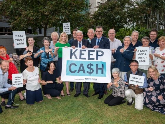 NSA Campaign to KEEP CASH. Brisbane, May 2024.  CEO Chris Grice and founding member Everald Compton with Six New Farm Branch members, and other supporters.